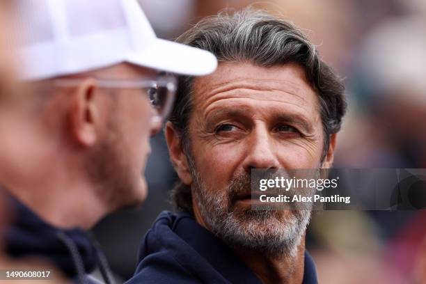 Patrick Mouratoglou looks on from the stands as Holger Rune of Denmark play Alexei Popyrin of Australia during their Men's Singles fourth round match...