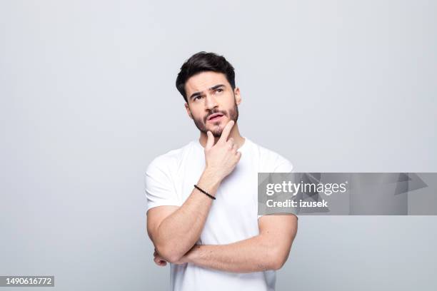 portrait of thoughtful young man - mind stock pictures, royalty-free photos & images