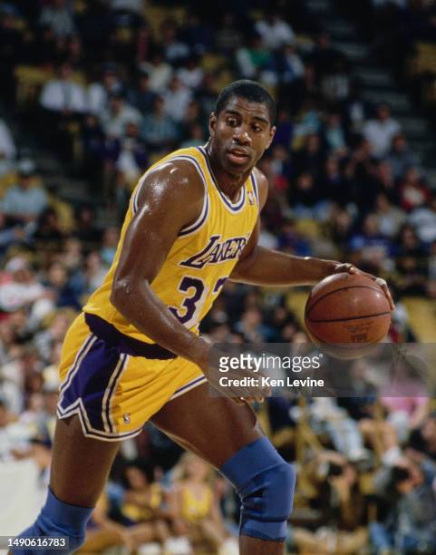 Earvin "Magic" Johnson, Shooting Guard and Power Forward for the Los Angeles Lakers dribbles the basketball down court during the NBA Pacific...