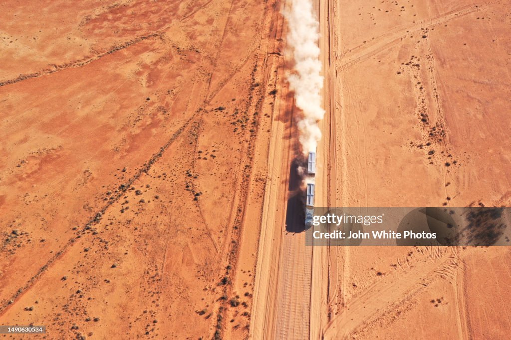 Truck driving on the red dusty Strzelecki Track. Mount Lyndhurst. South Australia.