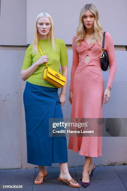 Guest wearing green top, blue skirt and Tory Burch shoes at Afterpay Australian Fashion Week 2023 at Carriageworks on May 16, 2023 in Sydney,...
