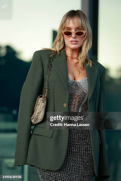 Jess King wearing Dion Lee dress, green blazer and shoes, Zimmerman sunglasses, and Fendi bag at Afterpay Australian Fashion Week 2023 at...