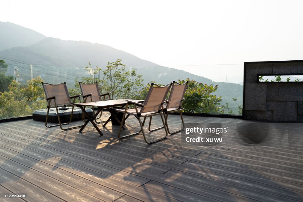 Rest Table And Chairs On The Wooden Floor At The Door High-Res Stock ...