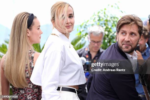 Jury members Brie Larson and Julia Ducournau, and Jury President Ruben Östlund attend the jury photocall at the 76th annual Cannes film festival at...