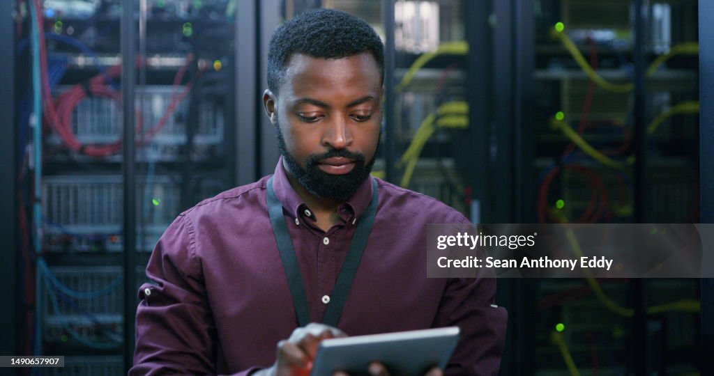 Tablet, man and technician check server room for cloud computing or cyber security at night. Tech, it engineer and male person working on database for maintenance or networking in data center