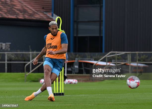 Joelinton strikes the ball during the Newcastle United Training Session at the Newcastle United Training Centre on May 16, 2023 in Newcastle upon...