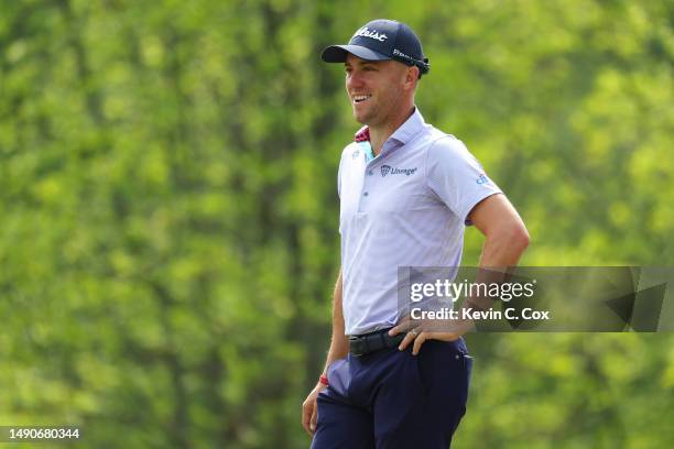 Justin Thomas of the United States smiles on the 14th hole during a practice round prior to the 2023 PGA Championship at Oak Hill Country Club on May...