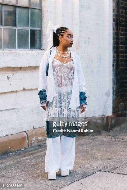 Guest wears thrifted and customised outfit with Novo shoes at Afterpay Australian Fashion Week 2023 at Carriageworks on May 16, 2023 in Sydney,...