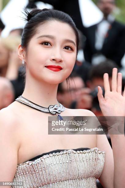 Guan Xiaotong attends the "Jeanne du Barry" Screening & opening ceremony red carpet at the 76th annual Cannes film festival at Palais des Festivals...