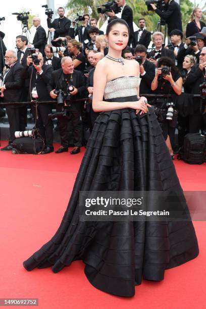 Guan Xiaotong attends the "Jeanne du Barry" Screening & opening ceremony red carpet at the 76th annual Cannes film festival at Palais des Festivals...