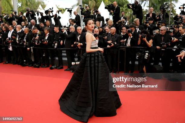 Guan Xiaotong attends the "Jeanne du Barry" Screening & opening ceremony red carpet at the 76th annual Cannes film festival at Palais des Festivals...