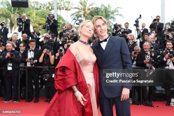 Uma Thurman and Levon Roan Thurman-Hawke attend the "Jeanne du Barry" Screening & opening ceremony red carpet at the 76th annual Cannes film festival...