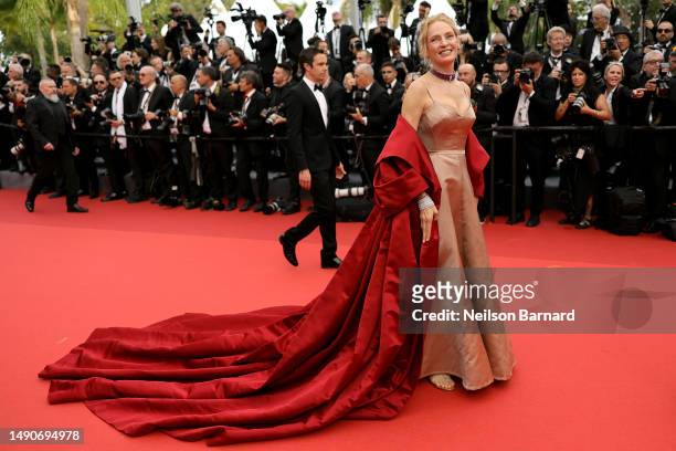 Uma Thurman attends the "Jeanne du Barry" Screening & opening ceremony red carpet at the 76th annual Cannes film festival at Palais des Festivals on...