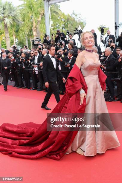 Uma Thurman attends the "Jeanne du Barry" Screening & opening ceremony red carpet at the 76th annual Cannes film festival at Palais des Festivals on...