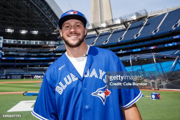 Josh Allen, quarterback of the Buffalo Bills, is photographed during batting practice ahead of the MLB game between the Toronto Blue Jays and the New...
