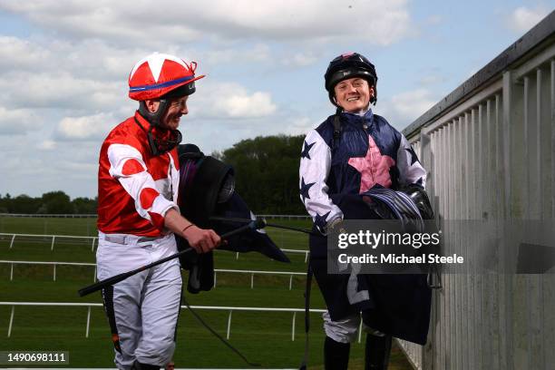 Jockey, Hollie Doyle and William Carson joke following her ride on Macs Dilemma at Chepstow Racecourse on May 16, 2023 in Chepstow, Wales.