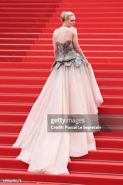 Elle Fanning attends the "Jeanne du Barry" Screening & opening ceremony red carpet at the 76th annual Cannes film festival at Palais des Festivals on...