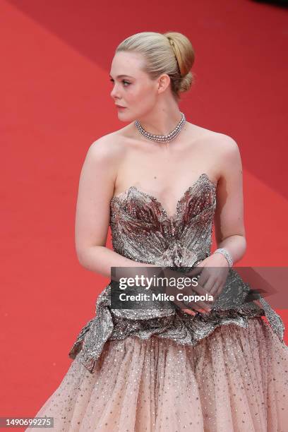 Elle Fanning attends the "Jeanne du Barry" Screening & opening ceremony red carpet at the 76th annual Cannes film festival at Palais des Festivals on...