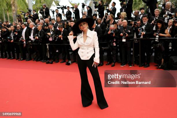 Emmanuelle Béart attends the "Jeanne du Barry" Screening & opening ceremony red carpet at the 76th annual Cannes film festival at Palais des...