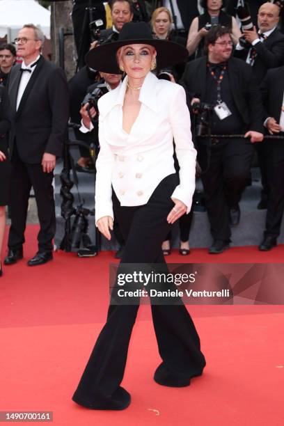 Emmanuelle Béart attends the "Jeanne du Barry" Screening & opening ceremony red carpet at the 76th annual Cannes film festival at Palais des...