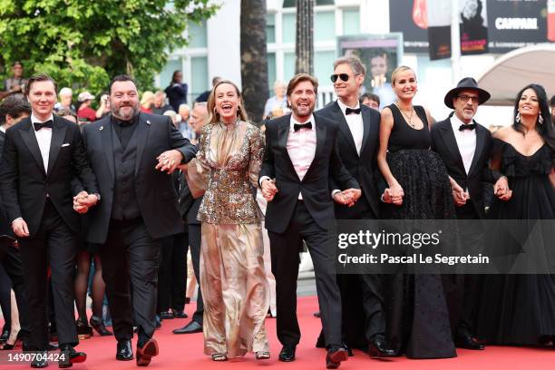 Members of the Jury Paul Dano, Denis Ménochet, Brie Larson, President of the Jury Ruben Östlund, Damian Szifron, Julia Ducournau, Atiq Rahimi and...