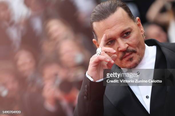 Johnny Depp attends the "Jeanne du Barry" Screening & opening ceremony red carpet at the 76th annual Cannes film festival at Palais des Festivals on...