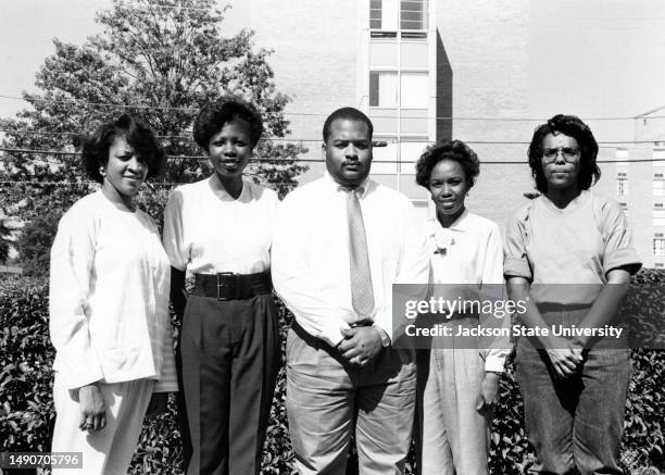 Delta Mu Delta members posing for photograph on college.