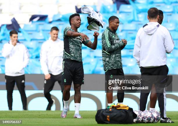 Vinicius Junior of Real Madrid throws his tracksuit during a training session ahead of their UEFA Champions League semi-final second leg match...