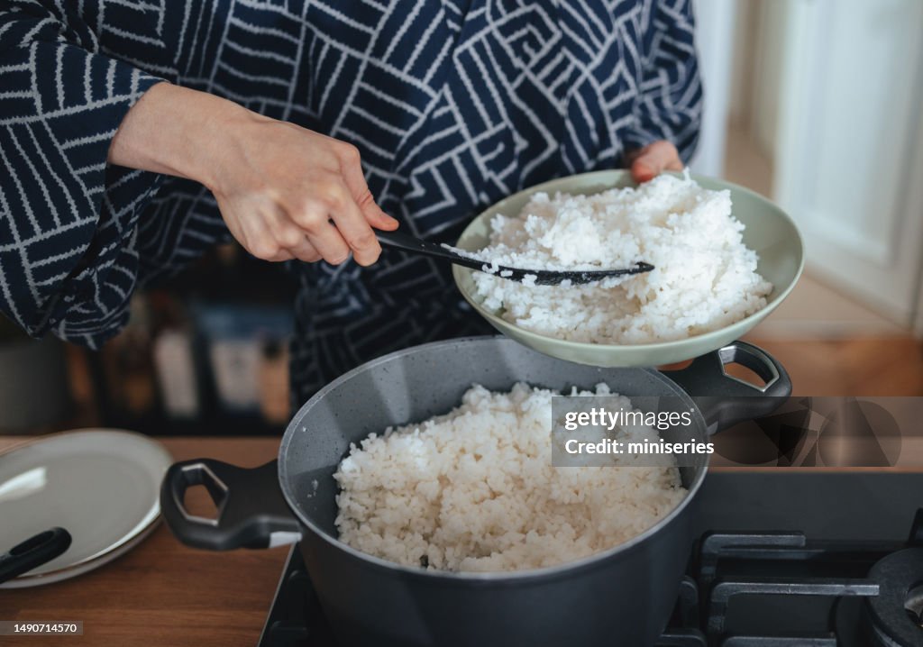 Anonymous Woman Preparing Rice at Home