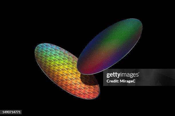 silicon wafers side by side on black background - wafer stock pictures, royalty-free photos & images