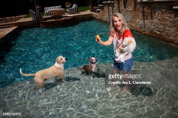 Actress Kaley Cuoco is photographed with her three dogs : Shirley, Ruby and Norman on August 7, 2017 in Tarzana, California. Cuoco is a board member...