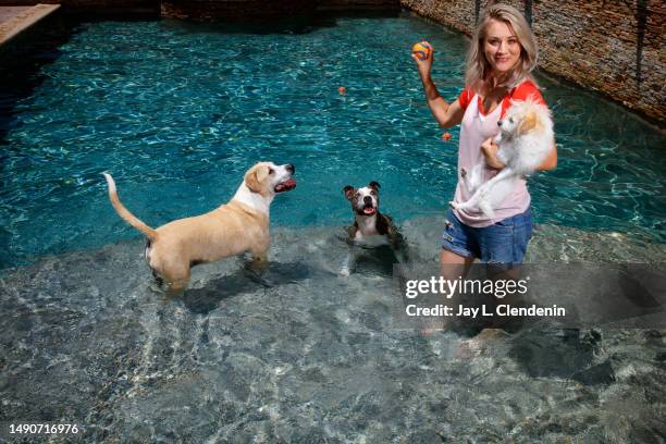 Actress Kaley Cuoco is photographed with her three dogs : Shirley, Ruby and Norman on August 7, 2017 in Tarzana, California. Cuoco is a board member...