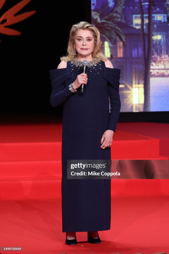catherine-deneuve-speaks-on-stage-during-the-opening-ceremony-at-the-76th-annual-cannes-film.jpg
