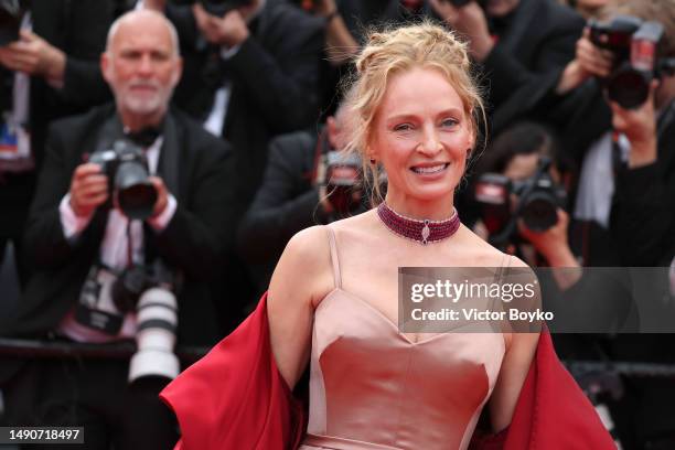 Uma Thurman attends the "Jeanne du Barry" Screening & opening ceremony red carpet at the 76th annual Cannes film festival at Palais des Festivals on...