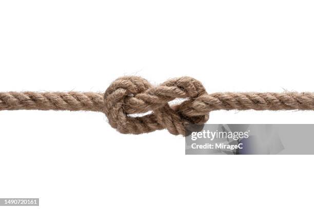 figure 8 knot tied with hemp rope isolated on white - tied knot stock pictures, royalty-free photos & images
