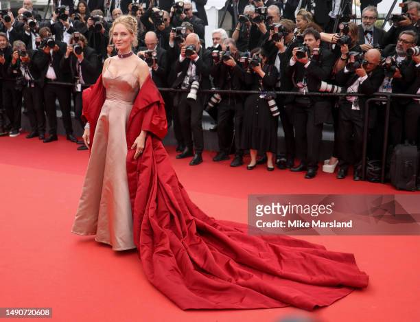 Uma Thurman attends the "Jeanne du Barry" Screening & opening ceremony red carpet at the 76th annual Cannes film festival at Palais des Festivals on...