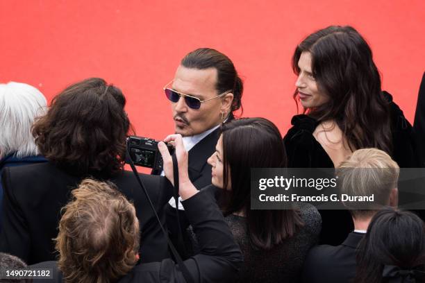 Johnny Depp and Maïwenn attend the "Jeanne du Barry" Screening & opening ceremony red carpet at the 76th annual Cannes film festival at Palais des...