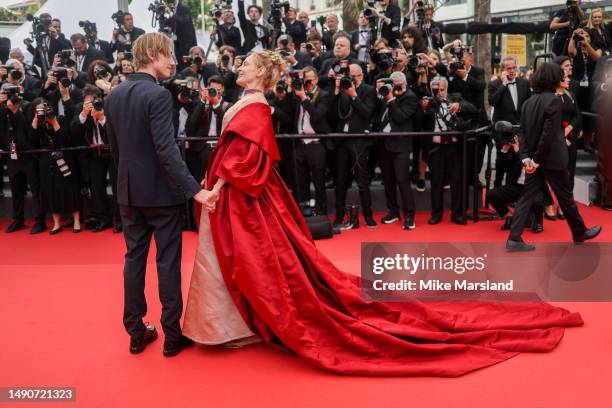 Uma Thurman and Levon Roan Thurman-Hawke attend the "Jeanne du Barry" Screening & opening ceremony red carpet at the 76th annual Cannes film festival...