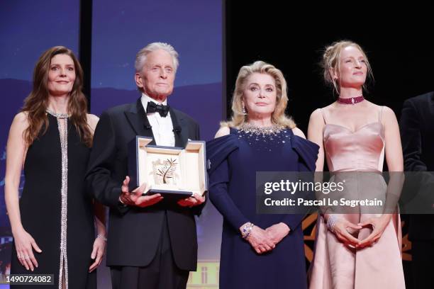 Mistress of ceremonies Chiara Mastroianni, Michael Douglas with the Honorary Palme D’Or, Catherine Deneuve and Uma Thurman during the opening...