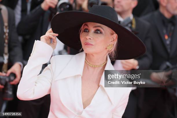 Emmanuelle Béart attends the "Jeanne du Barry" Screening & opening ceremony red carpet at the 76th annual Cannes film festival at Palais des...