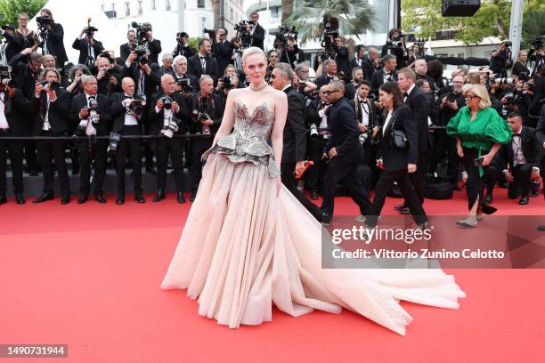 Elle Fanning attends the "Jeanne du Barry" Screening & opening ceremony red carpet at the 76th annual Cannes film festival at Palais des Festivals on...