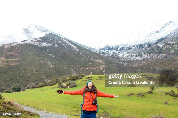 young female hiker with eyes closed breathing fresh air in nature. - paisaje escénico stock pictures, royalty-free photos & images