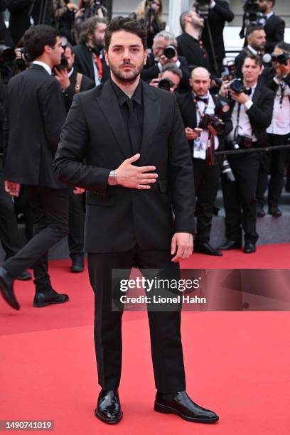 Xavier Dolan attends the "Jeanne du Barry" screening & opening ceremony red carpet at the 76th Annual Cannes Film Festival at Palais des Festivals on...