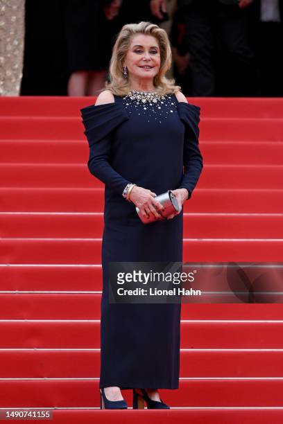 Catherine Deneuve attends the "Jeanne du Barry" screening & opening ceremony red carpet at the 76th Annual Cannes Film Festival at Palais des...