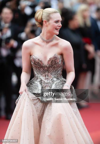 Elle Fanning during "Jeanne du Barry" screening and Opening Ceremony red carpet during the 76th Annual Cannes Film Festival at Palais des Festivals...