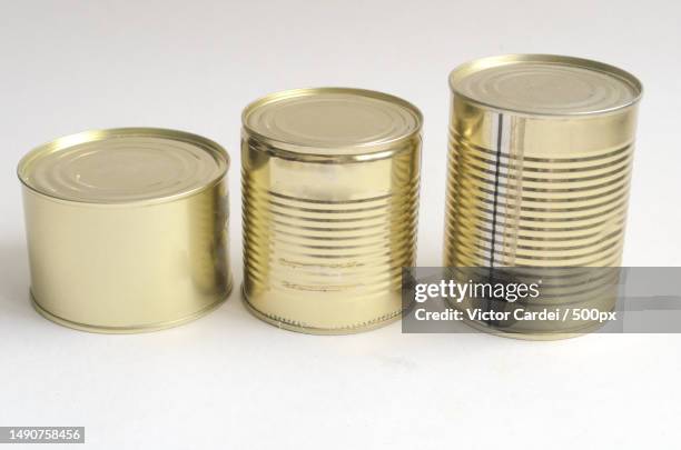 three canned food items on a white background arranged in ascending order,romania - cilindro fotografías e imágenes de stock