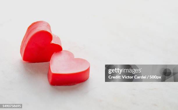 two valentine hearts on white background,copyspace,romania - candy heart stock pictures, royalty-free photos & images