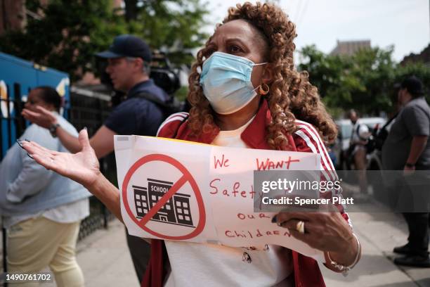Residents, students and parents gather for as protest in front of P.S. 188 in Coney Island which has recently begun housing asylum seekers in the...