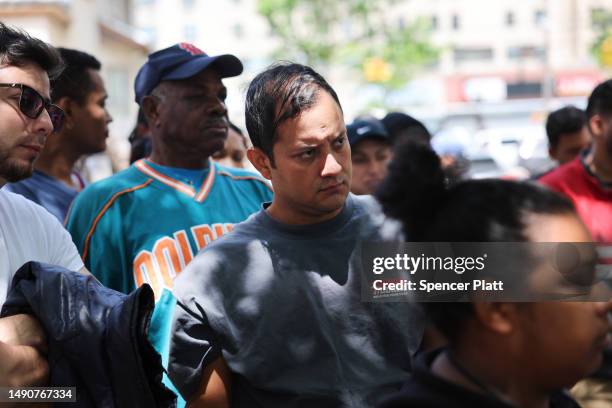 Recently arrived asylum seekers get information on free health care in front of P.S. 188 in Coney Island which has recently begun housing migrants in...