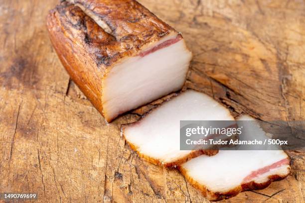 sliced smoked lard on a wooden background,romania - lard stock pictures, royalty-free photos & images